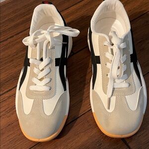 Stylish White and Black Sneakers with Tan Accents